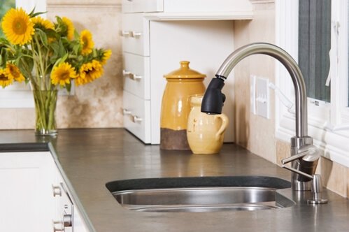 A kitchen sink backsplash can look classy and be functional.