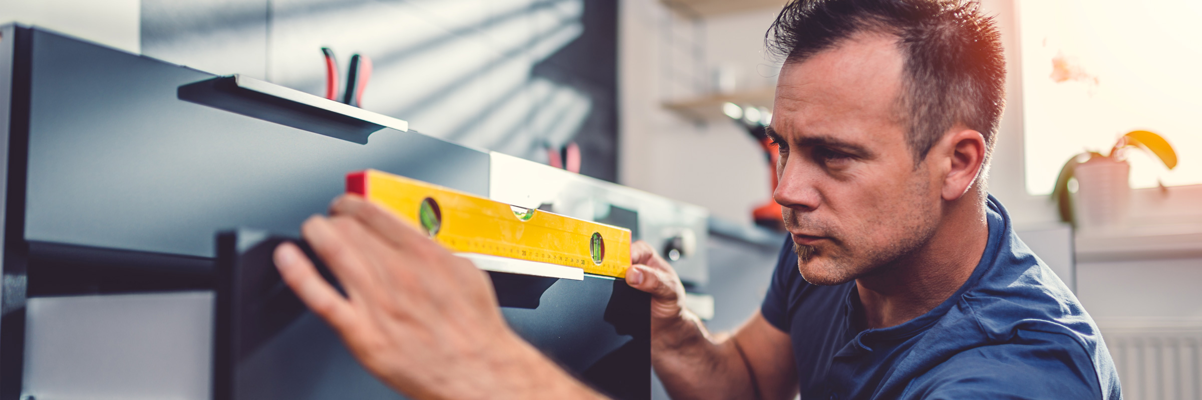 Man measuring a drawer